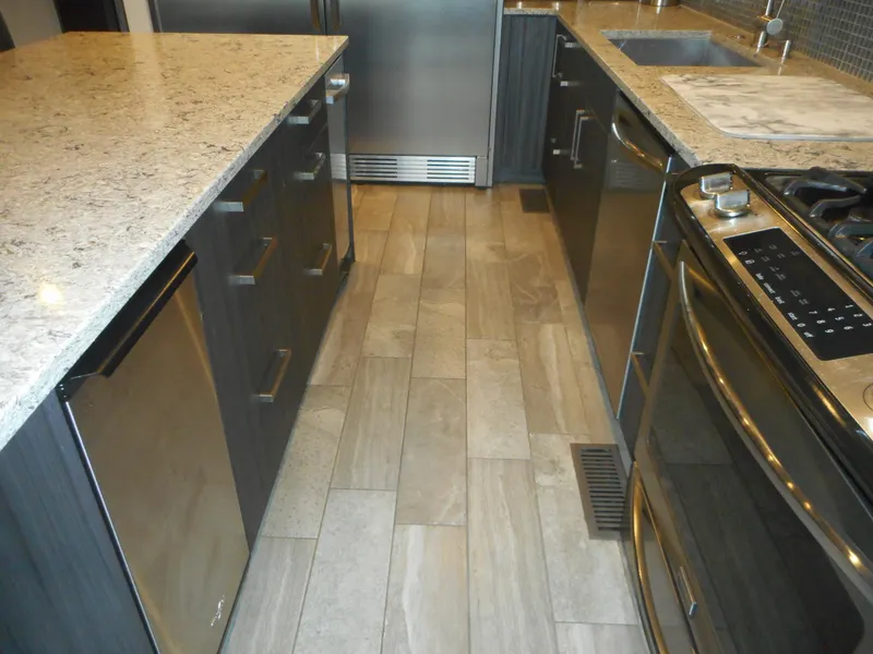 Slide: The Image of Modern kitchen with granite countertops, stainless steel appliances, and sleek cabinetry in Adonia Liquidity Trip 5. - 29