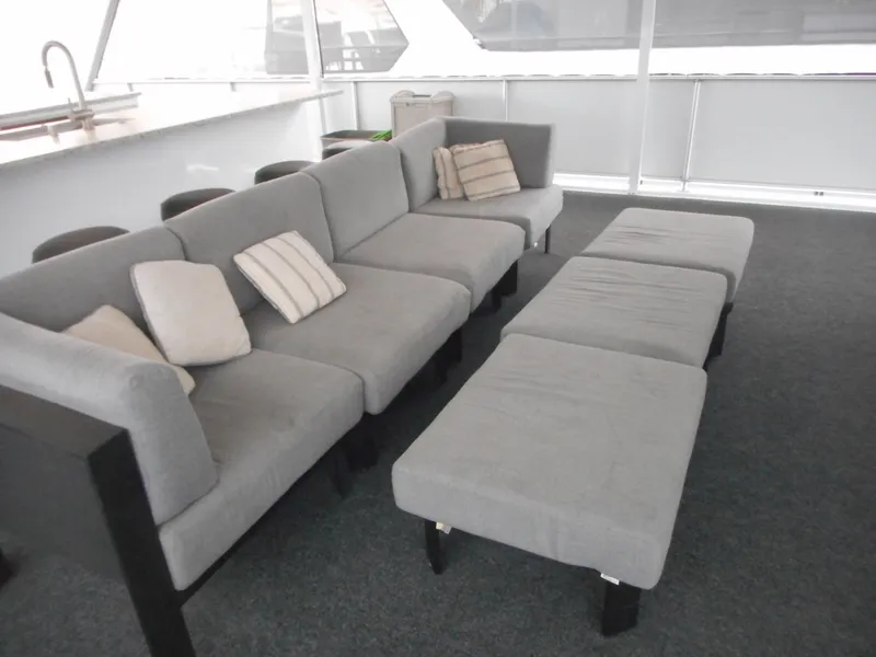 Slide: The Image of Gray seating area on Adonia Liquidity Trip 5 yacht, 2017 model, with cushions and stools. - 37