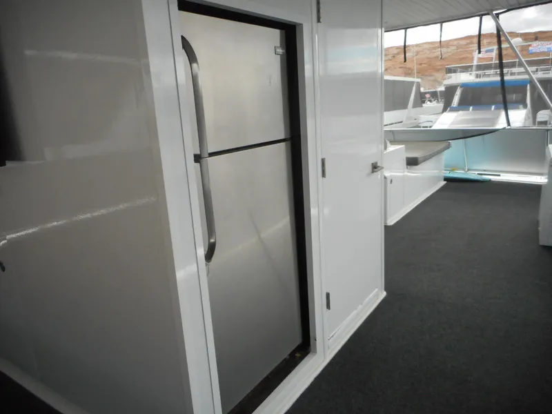 Slide: The Image of Interior view of 2017 Adonia Liquidity Trip 5 yacht, featuring a sleek stainless steel refrigerator. - 38