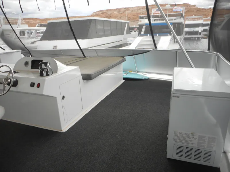 Slide: The Image of Upper deck of 2017 Adonia Liquidity Trip 5 houseboat with seating and appliances. - 39