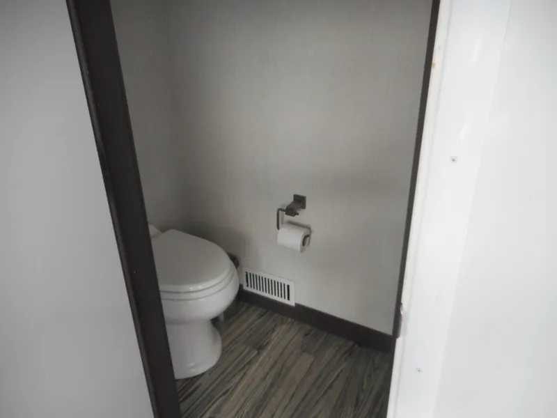 Slide: The Image of Compact bathroom in Adonia Liquidity Trip 5, 2017 model, featuring modern toilet and wood-style flooring. - 40