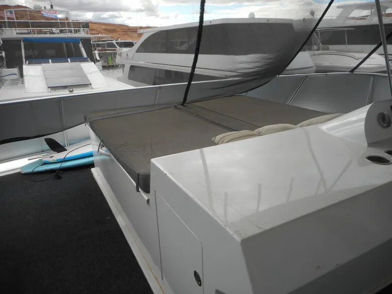 Slide: The Image of Luxury yacht deck with seating area, Adonia Liquidity Trip 5, 2017 model, docked at marina. - 41