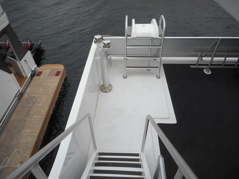 Slide: The Image of Staircase and deck area on Adonia Liquidity Trip 5 yacht, 2017 model, near water. - 45