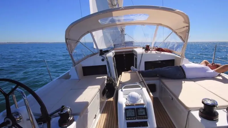 Slide: The Image of 2024 Jeanneau Sun Odyssey 440 sailing on open sea, featuring spacious deck and modern design. - 10