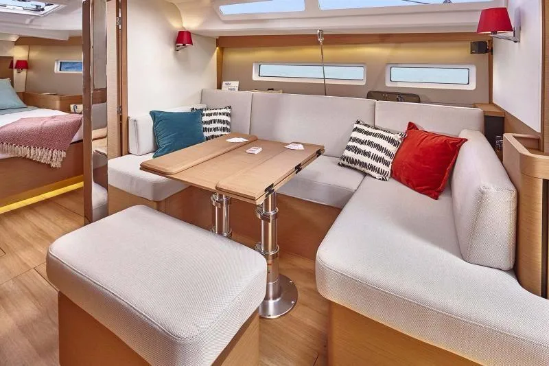 Slide: The Image of 2024 Jeanneau Sun Odyssey 440 interior with cozy seating and modern design. - 2