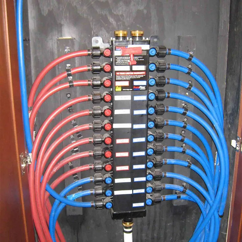 Slide: The Image of Water manifold system with red and blue pipes on a 2010 Bravada Houseboat Dream Catcher. - 10