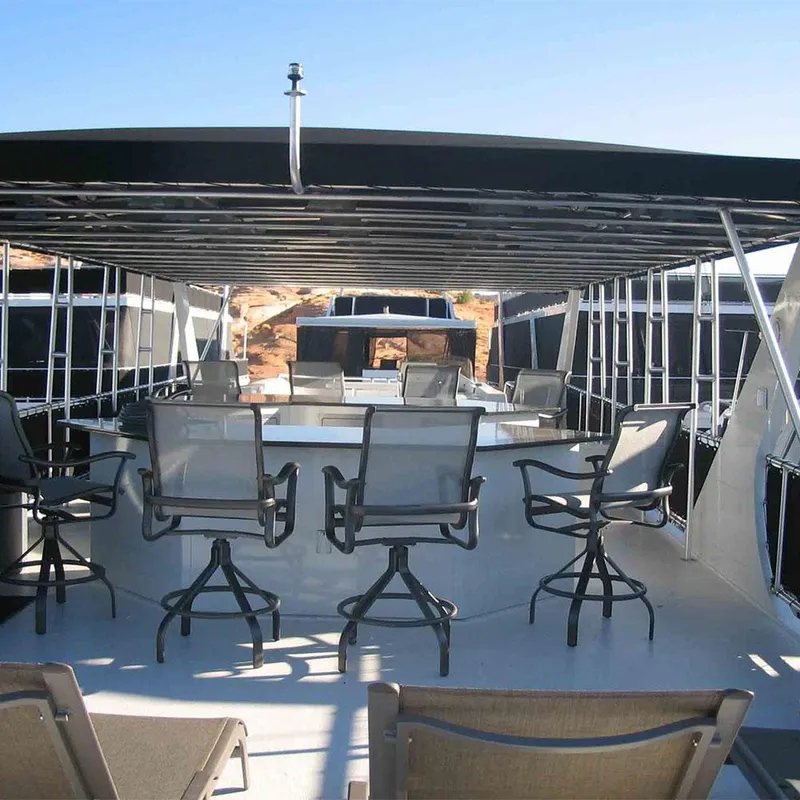 Slide: The Image of 2010 Bravada Houseboat Dream Catcher SHARE #16 with spacious deck and seating area. - 12