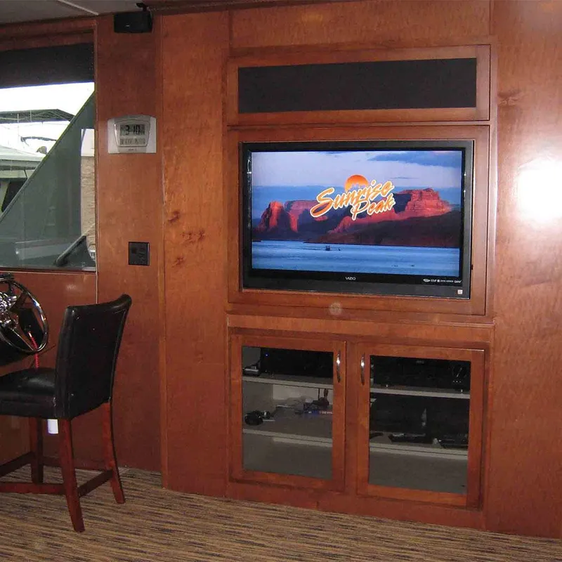 Slide: The Image of Interior of 2010 Bravada Houseboat Dream Catcher with TV and wooden cabinetry. - 4
