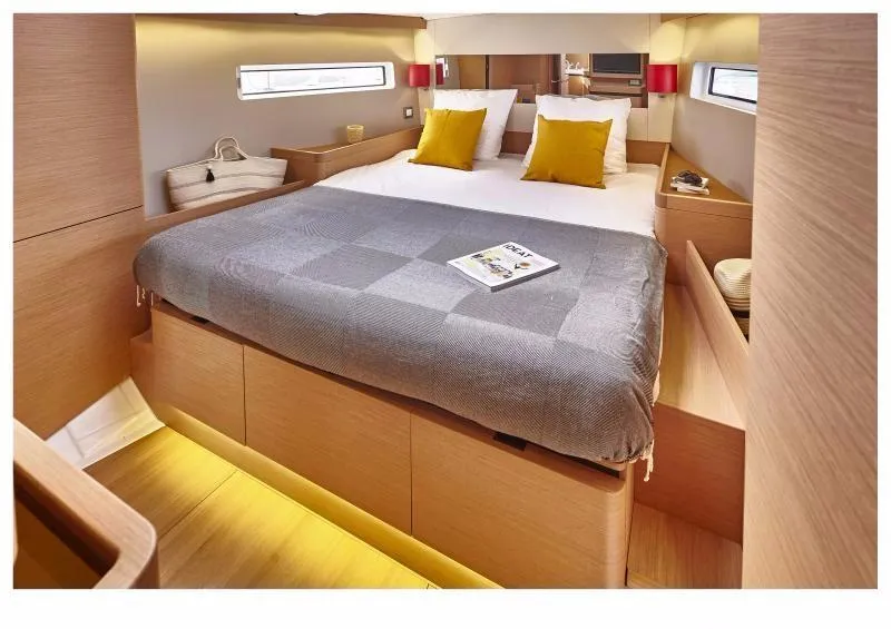 Slide: The Image of Luxurious cabin interior of 2024 Jeanneau Sun Odyssey 490 yacht with cozy bedding. - 12
