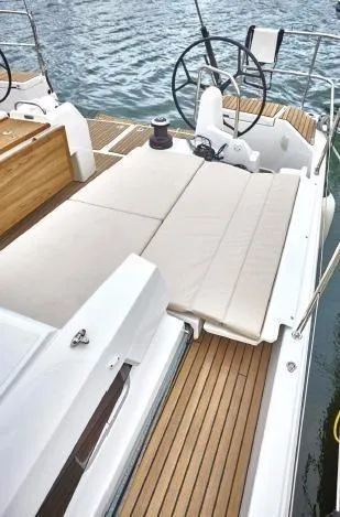 Slide: The Image of 2024 Jeanneau Sun Odyssey 490 yacht with spacious deck and comfortable seating. - 6