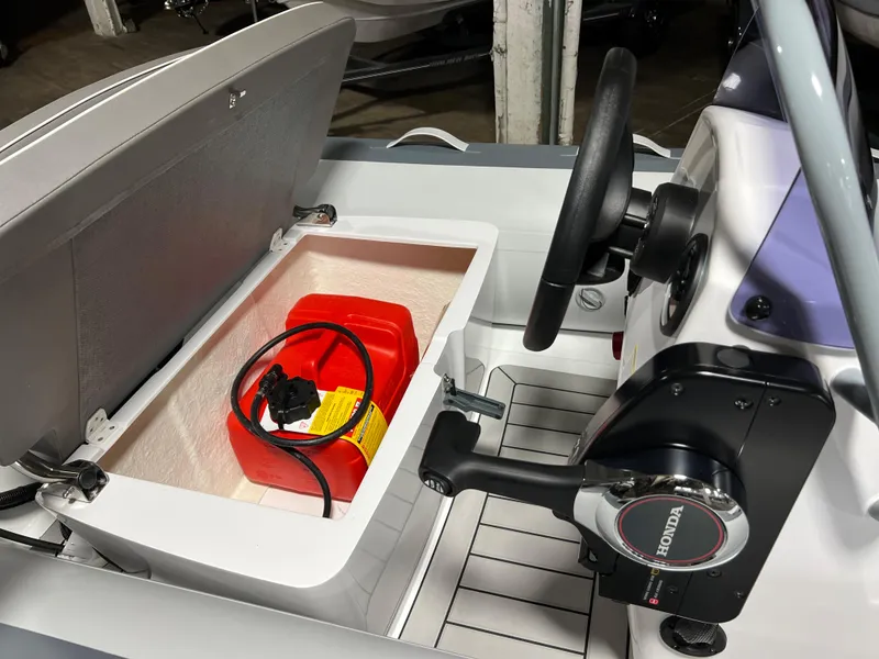 Slide: The Image of 2023 Gala A330L boat interior with storage compartment and Honda control. - 11