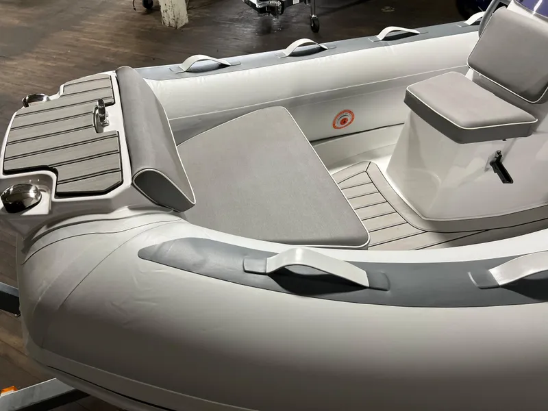 Slide: The Image of 2023 Gala A330L inflatable boat interior with seating and storage compartments. - 7