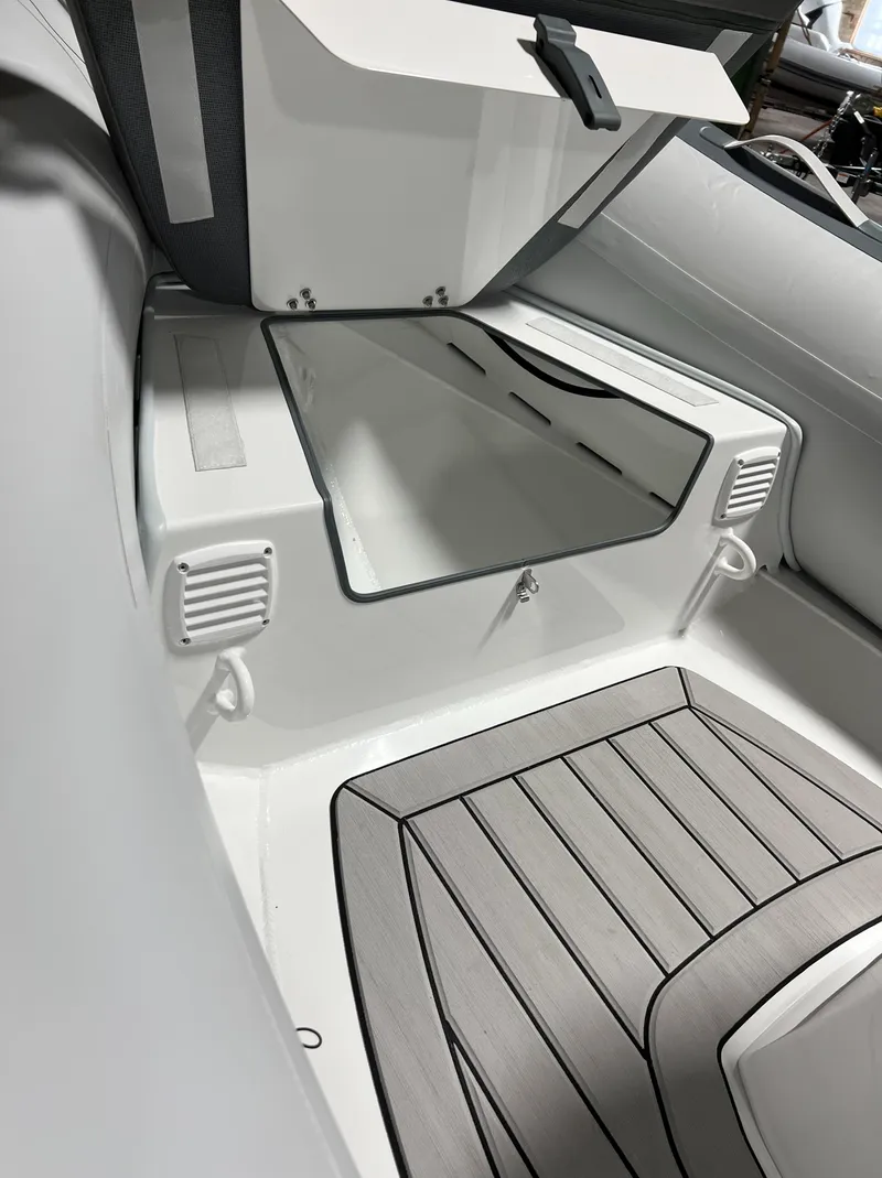 Slide: The Image of 2023 Gala A330L boat interior storage compartment with open hatch. - 8