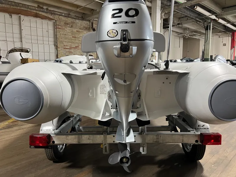 Slide: The Image of Rear view of 2023 Gala A330L inflatable boat with 20 HP outboard motor. - 9
