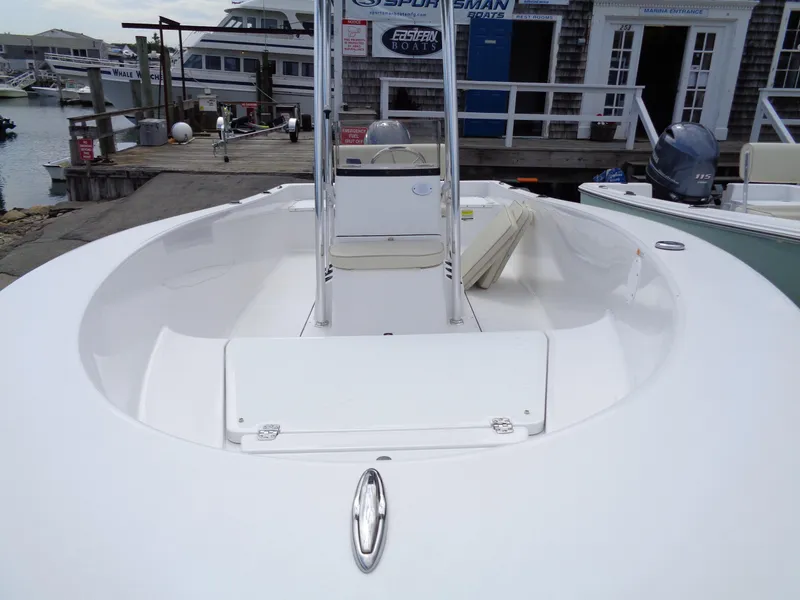 Slide: The Image of 2018 Sportsman Island Reef 19 Center Console boat docked at marina. - 3