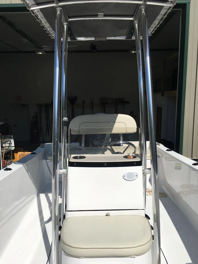 Slide: The Image of 2018 Sportsman Island Reef 19 Center Console boat with T-top and seating. - 5