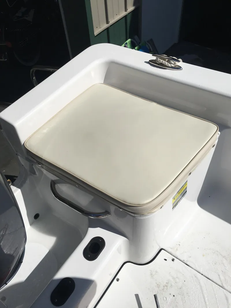 Slide: The Image of 2018 Sportsman Island Reef 19 Center Console seat with white cushion. - 8