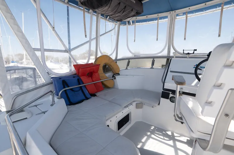 Slide: The Image of 1996 Albin 32 Command Bridge interior with seating and life jackets. - 16