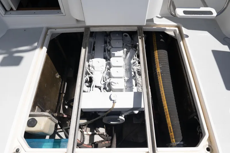 Slide: The Image of Engine compartment of a 1996 Albin 32 Command Bridge boat, showcasing mechanical components. - 20