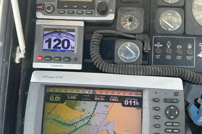 Slide: The Image of Control panel of a 1996 Albin 32 Command Bridge with navigation instruments. - 30