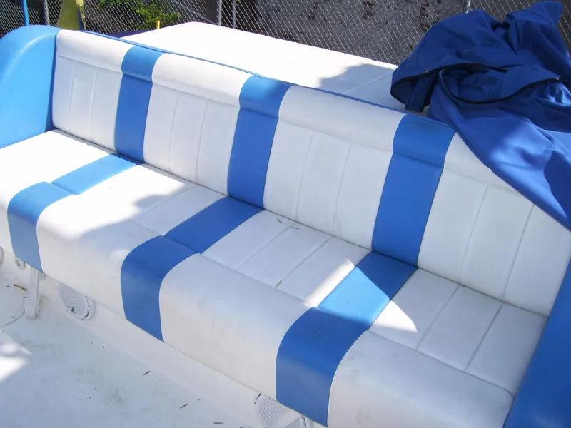 Slide: The Image of Blue and white striped boat seat on a 2002 Mares 38 High Performance. - 16