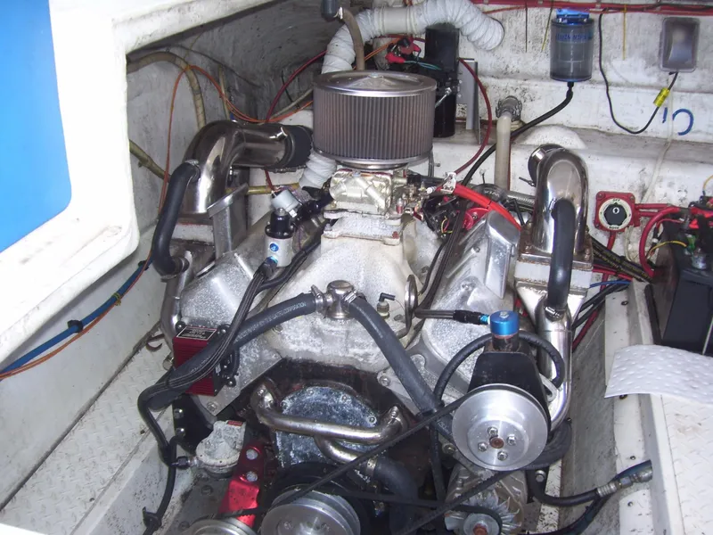 Slide: The Image of Engine compartment of a 2002 Mares 38 High Performance boat, showcasing detailed components. - 21