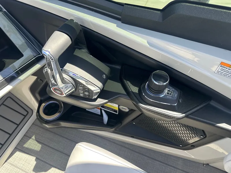 Slide: The Image of 2021 Monterey M6 boat console with steering wheel and touchscreen display. - 10