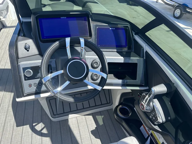 Slide: The Image of 2021 Monterey M6 boat with 8.2L engine, 380HP, on trailer. - 14