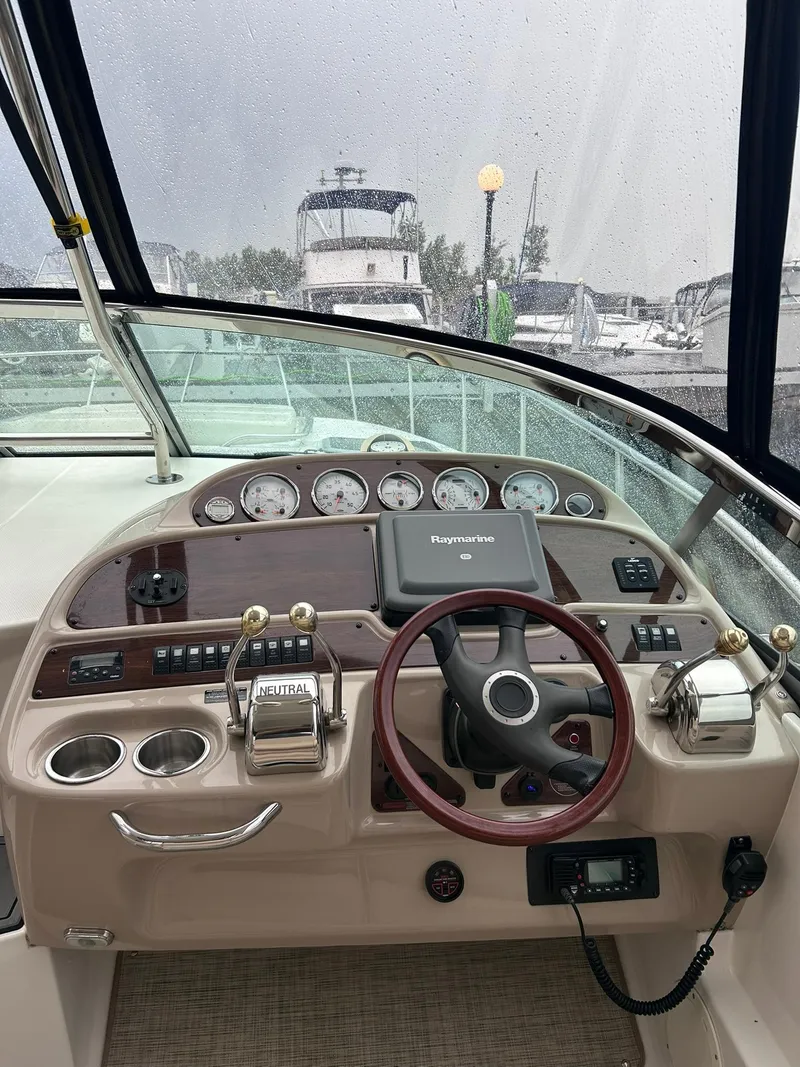 Slide: The Image of 2007 Chaparral 350 Signature boat helm with steering wheel and navigation instruments. - 10