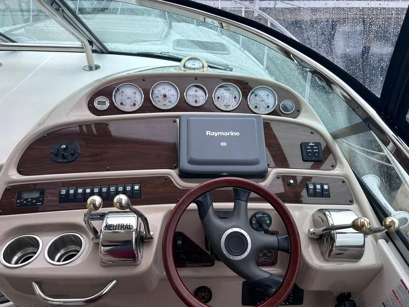 Slide: The Image of 2007 Chaparral 350 Signature boat dashboard with steering wheel and navigation controls. - 11