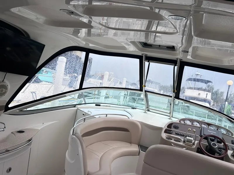 Slide: The Image of Interior view of 2007 Chaparral 350 Signature yacht cockpit with steering wheel and seating. - 12