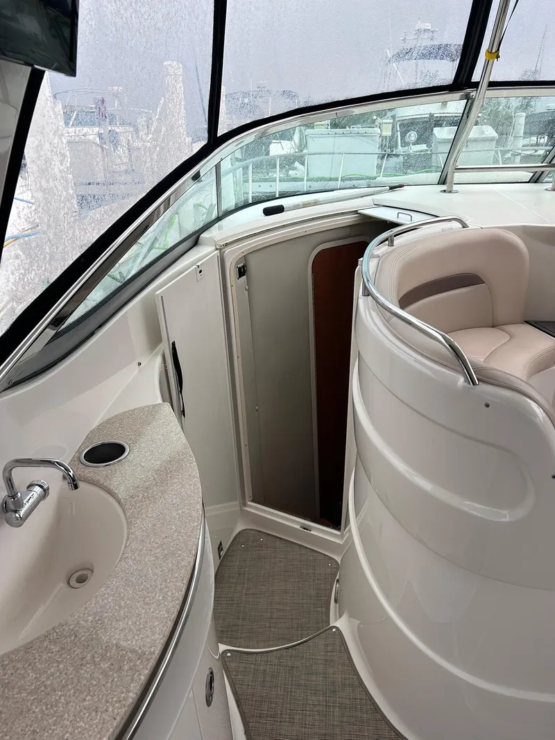 Slide: The Image of 2007 Chaparral 350 Signature boat interior with seating and sink area. - 14