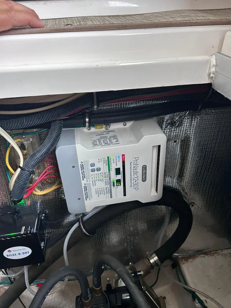 Slide: The Image of Engine compartment of a 2007 Chaparral 350 Signature with electrical components and wiring. - 18