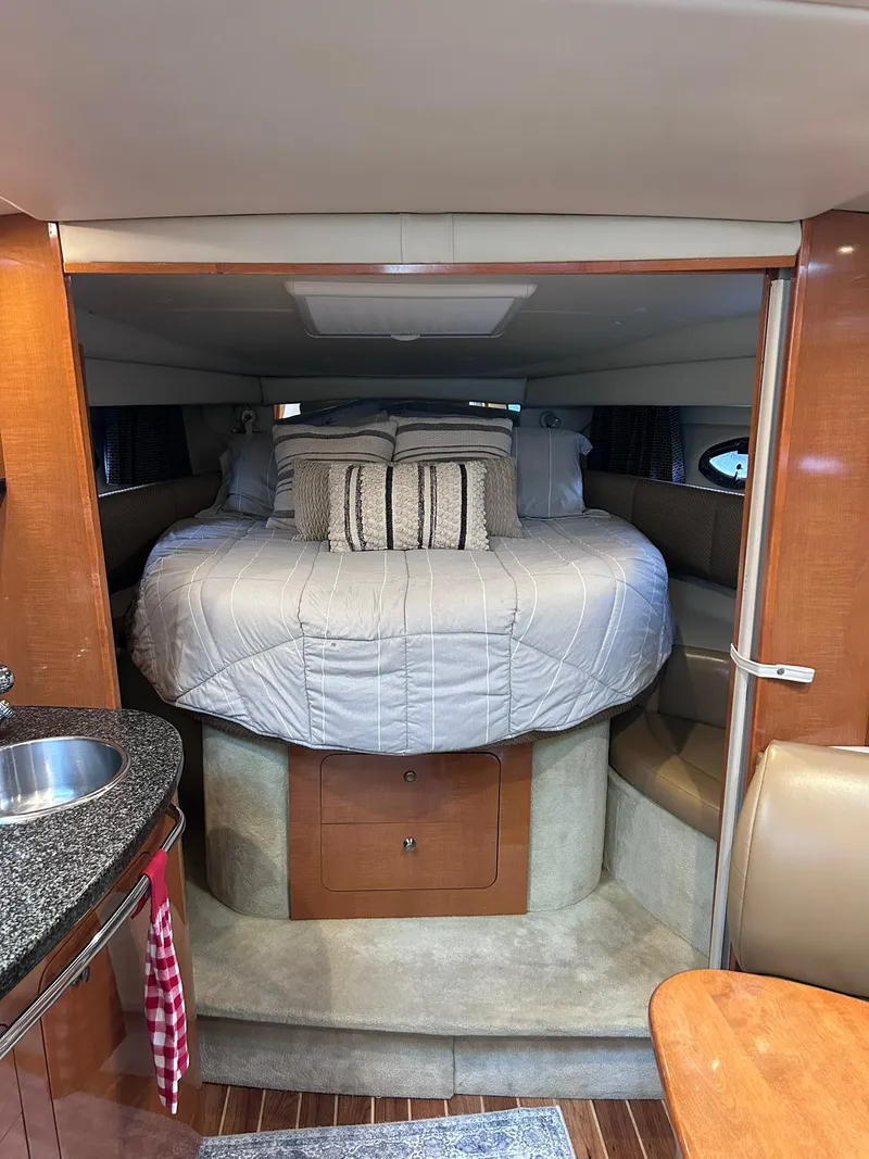 Slide: The Image of 2007 Chaparral 350 Signature cabin interior with cozy bed and modern amenities. - 21