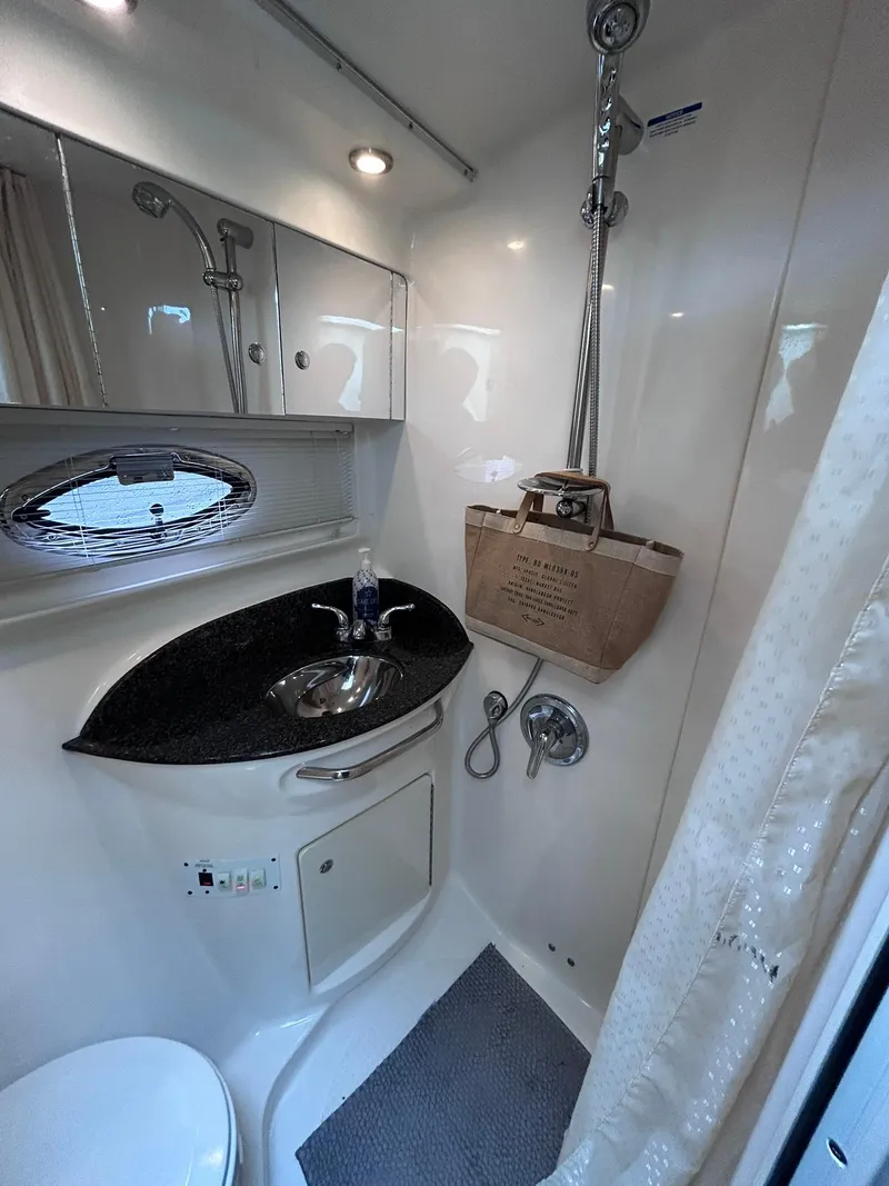 Slide: The Image of 2007 Chaparral 350 Signature bathroom with sink, shower, and storage. - 28