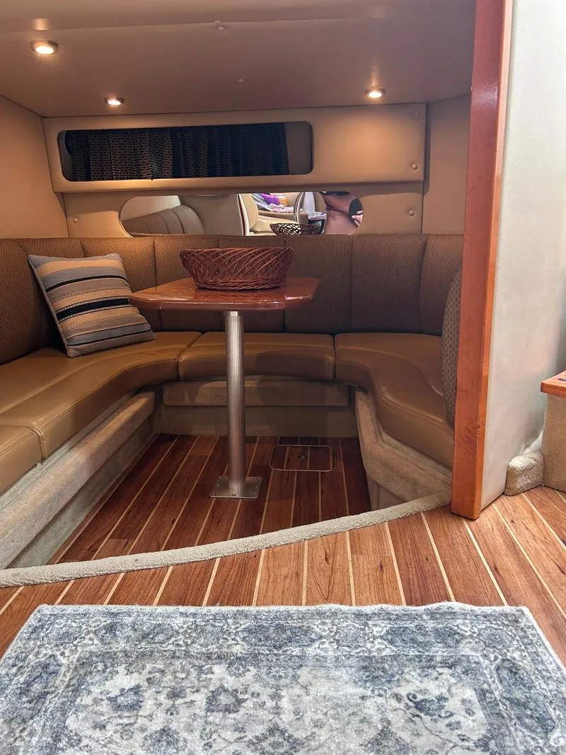 Slide: The Image of 2007 Chaparral 350 Signature cabin interior with cozy seating and wooden flooring. - 32
