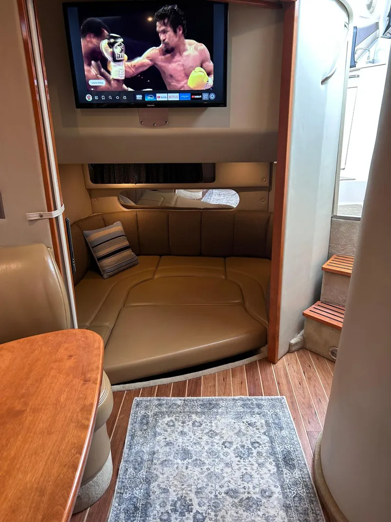 Slide: The Image of 2007 Chaparral 350 Signature interior with TV, leather seating, and wooden flooring. - 33