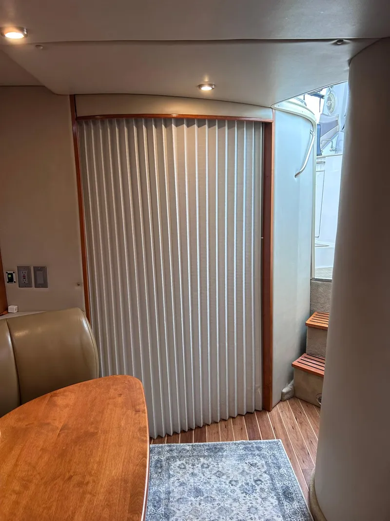 Slide: The Image of Interior of 2007 Chaparral 350 Signature yacht with wooden table and stairs. - 34