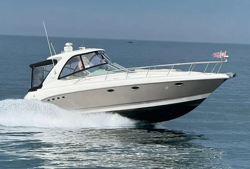 Slide: The Image of 2007 Chaparral 350 Signature cruising on open water, displaying sleek design and performance. - 7