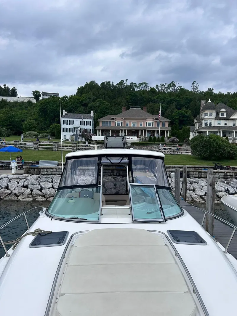 Slide: The Image of 2007 Chaparral 350 Signature yacht docked with scenic waterfront homes in the background. - 9