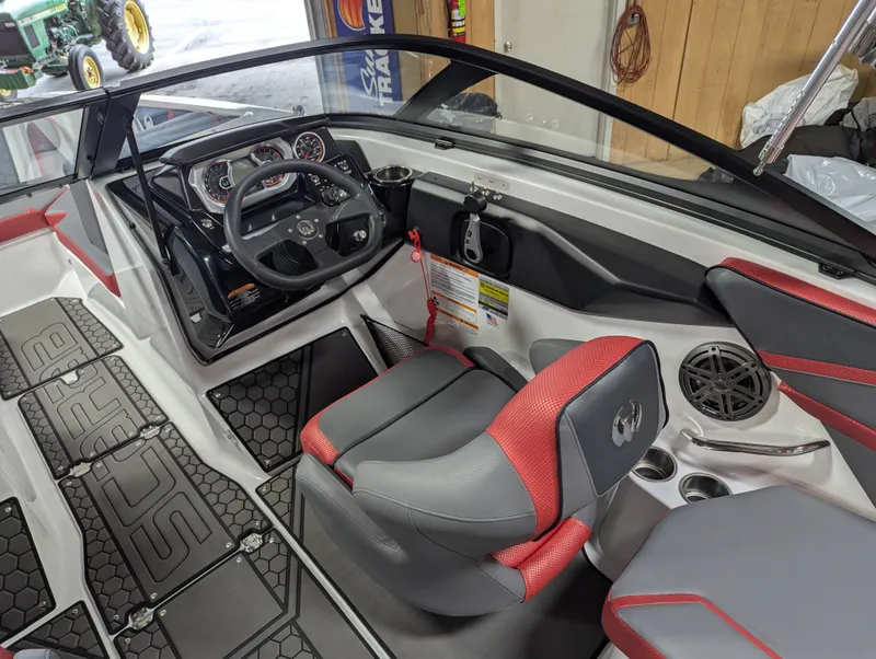 Slide: The Image of Interior of 2025 Scarab 215LX with modern dashboard and red accents. - 4