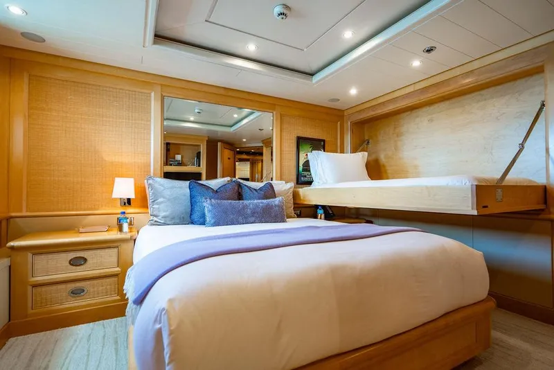 Slide: The Image of Luxurious bedroom interior on 2004 Amels Oceangoing yacht with elegant wood finishes. - 15