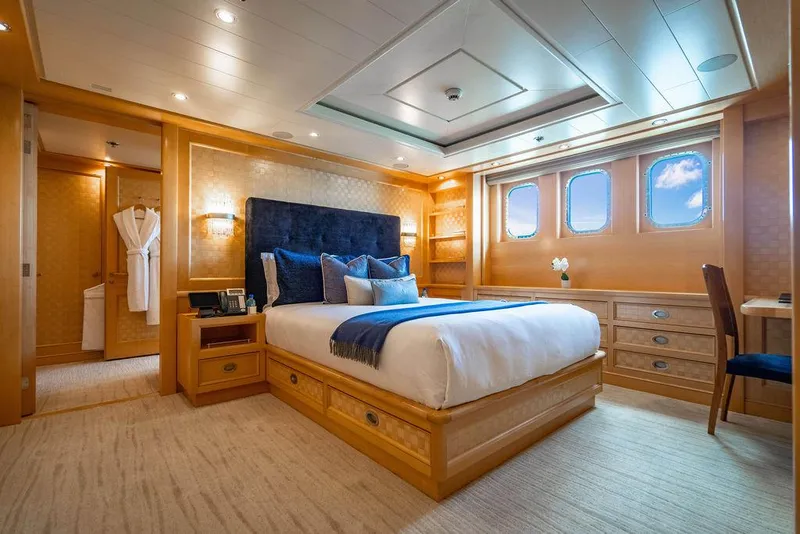 Slide: The Image of Luxurious bedroom on 2004 Amels Oceangoing yacht with elegant wood finishes and ocean view. - 17