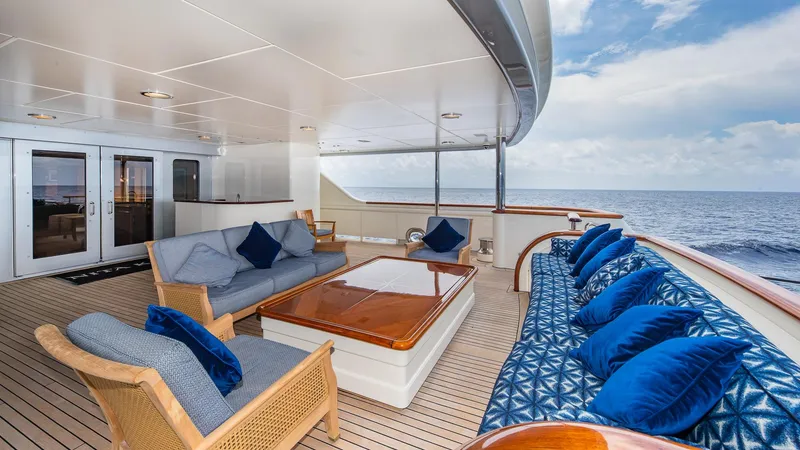 Slide: The Image of Luxurious 2004 Amels Oceangoing yacht deck with elegant seating and ocean view. - 2