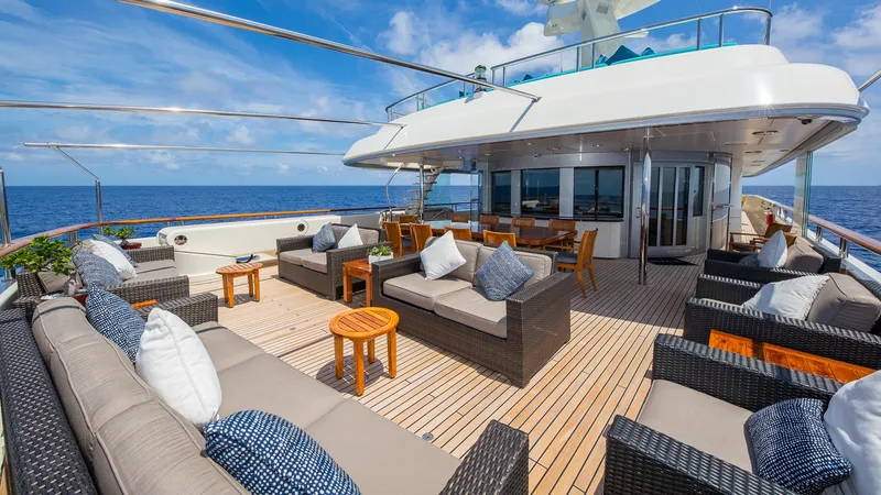 Slide: The Image of Luxurious 2004 Amels Oceangoing yacht deck with elegant seating and ocean view. - 26