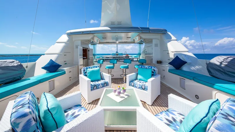 Slide: The Image of Luxurious 2004 Amels Oceangoing yacht deck with stylish seating and ocean view. - 28