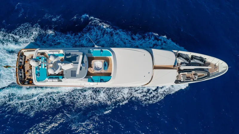 Slide: The Image of Aerial view of 2004 Amels Oceangoing yacht cruising in deep blue ocean waters. - 32