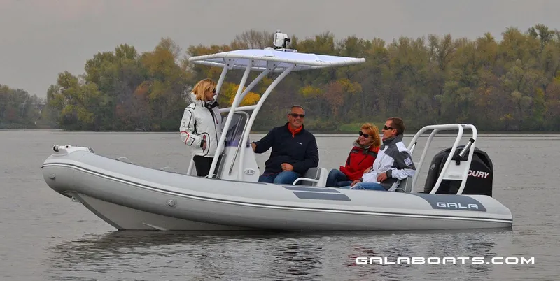 Slide: The Image of 2024 Gala VIKING V500 boat with passengers on a calm lake. - 3