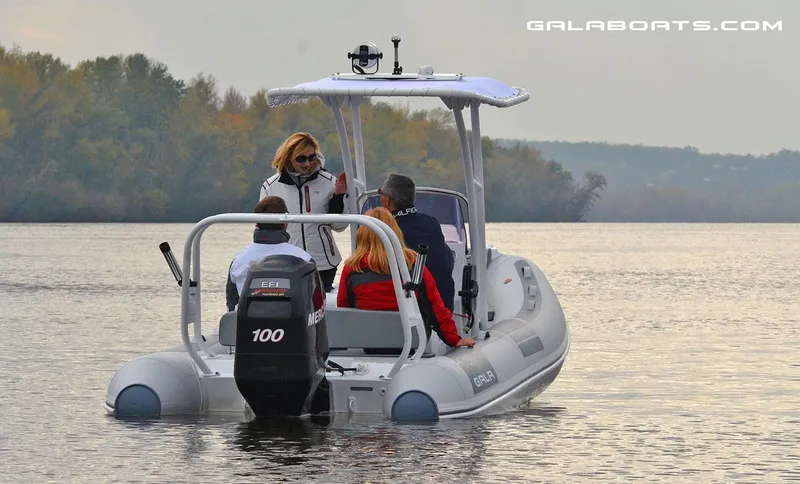 Slide: The Image of 2024 Gala VIKING V500 boat with passengers cruising on a calm lake. - 4
