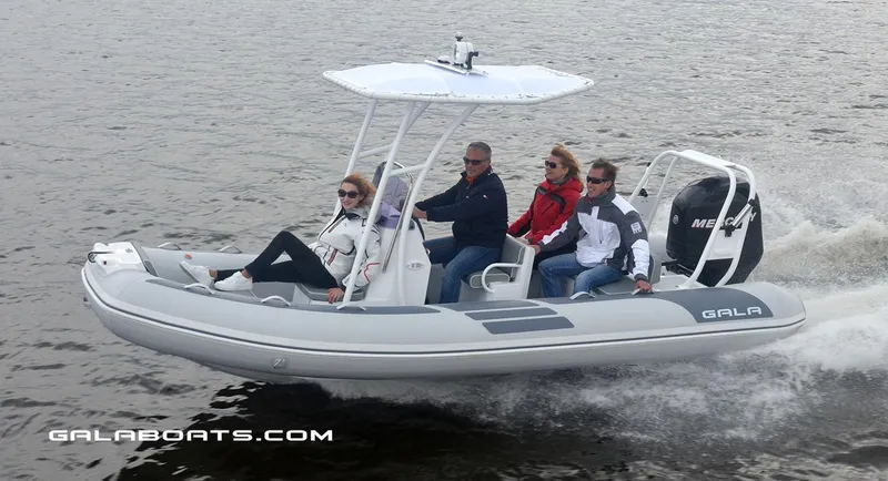 Slide: The Image of 2024 Gala VIKING V500 boat cruising with four passengers on a lake. - 5